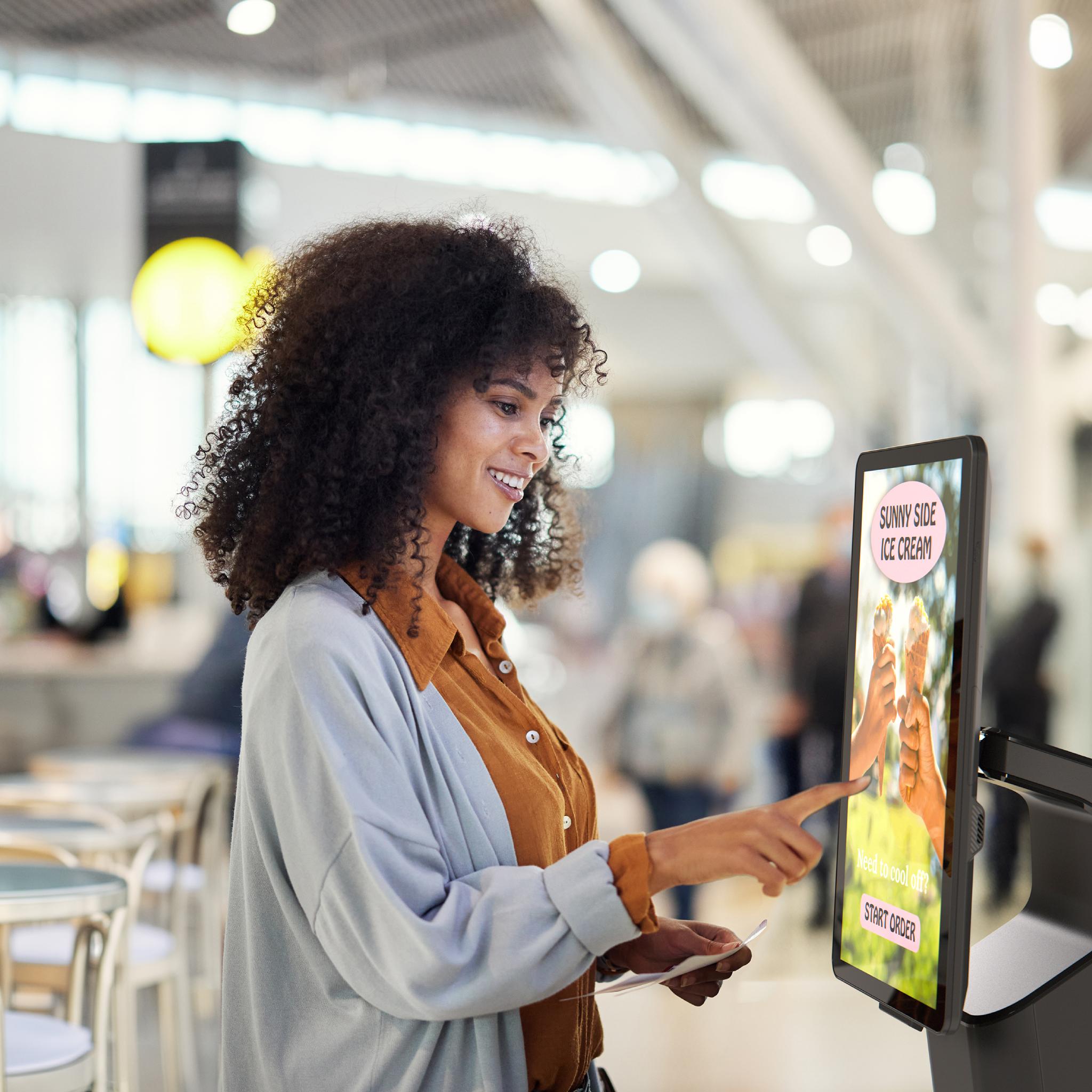 Customer using a self-service kiosk